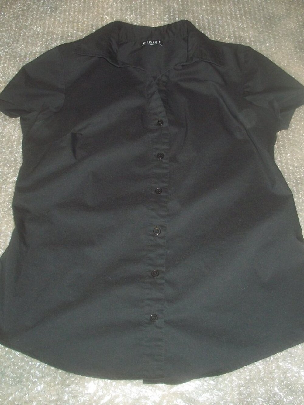 womens short sleeve black button front blouse. Size medium